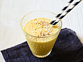 Golden milkshake with grated coconut