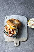 Salmon burger with sesame bun and yogurt dip