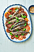 Sardines with tomato and almond salsa