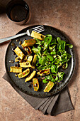 Lamb's lettuce with roasted ravioli and pumpkin seeds