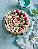 Wrap cake with fresh berries and mint