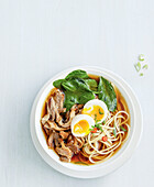 Pork ramen with spinach and egg