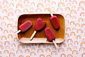 Beetroot ice cream on a stick