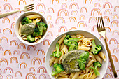 Penne with broccoli florets and pesto