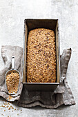 Bread with coarse meal and green spelt in loaf tin