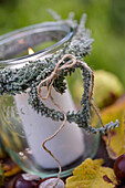 Glass lantern with heart of heather and string decoration