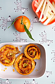 Puff pastry pesto buns with mandarin and vegetable sticks
