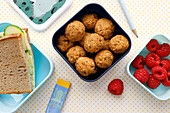 Carrot power balls, sandwiches and fresh raspberries