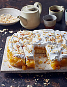 Peach and almond slices with cream topping