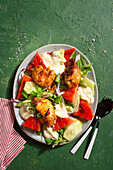 Baked chicken with watermelon and cucumber salad