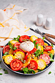 Colourful tomato salad with sweetcorn and burrata