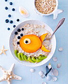 Fruit porridge for children with mango and fish