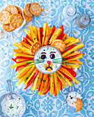 Colourful lion snack plate with vegetables and dip