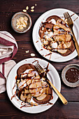 Chocolate pancakes with pear, yoghurt and almonds