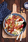 Salad with apple, ham, cucumber, yoghurt dip and croutons