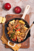 Fried meatballs with apples, mushrooms and onions