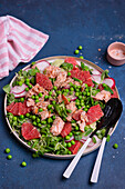 Salmon and grapefruit salad with peas and radishes