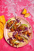 Jackfruit tacos with avocado, red cabbage and green salsa