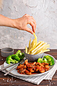 Pork in tomato sauce with beans and broccoli