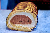 Sponge roll with chocolate and orange cream