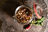 Pickled radishes in a preserving jar
