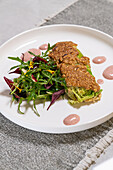 Savoy cabbage roulades with salad and sauce