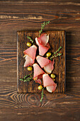 Prosciutto with olives and thyme