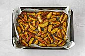 Oven-baked potato wedges with garlic and oregano