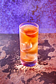 John Lee Hooker long drink with ice cubes and orange slice