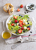 Frisee salad with berries and mozzarella