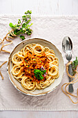 Spaghetti with soy bolognese and herbs