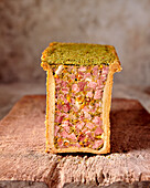 Pork pâté with pistachios and herb crust