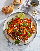 Carrot salad with ginger, cashew nuts and sesame seeds