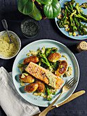 Salmon with creamy pesto sauce and Hasselback potatoes