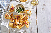 Deep-fried pierogi with sour cream dip