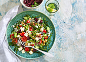 Greek salad with rice, feta and olives