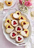 Heart-shaped wedding biscuits with raspberry jam