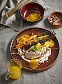 Carrots with orange and honey glaze and savoury quark dip