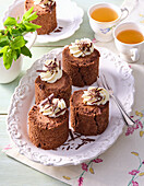 Chocolate sponge rolls with cream topping