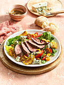 Salad with grilled beef steak, blue cheese and sweetcorn