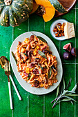 Pumpkin and chanterelle pasta with sage leaves and figs