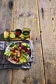 Tofu bowl with red cabbage, avocado and sriracha