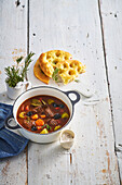 Tuscan beef stew with vegetables and olives