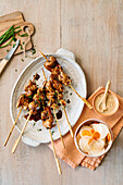 Teriyaki chicken skewers with radish and carrot salad