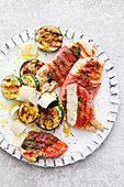 Grilled chicken saltimbocca with courgette slices