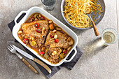 Pork chops with pickled peppers and potato straw