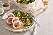 Turkey roulade with salsiccia filling and rocket and zucchini salad