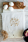 Colored eggs with dried flowers