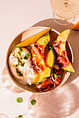 Melon with prosciutto and burrata