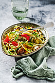 Mediterranean spaghetti with pesto and grilled vegetables